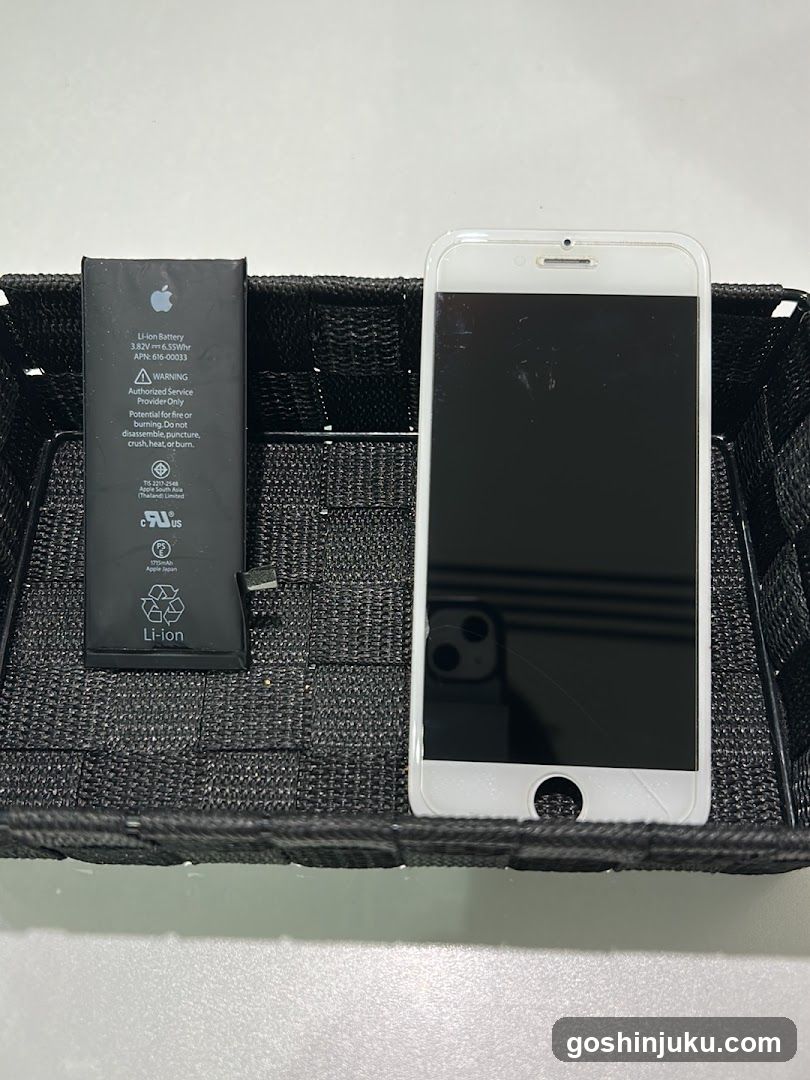 iPhone and battery in basket