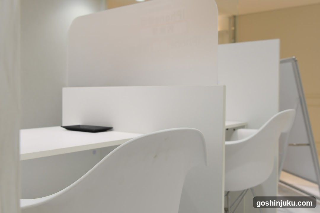 White Office Interior with Desks and Chairs