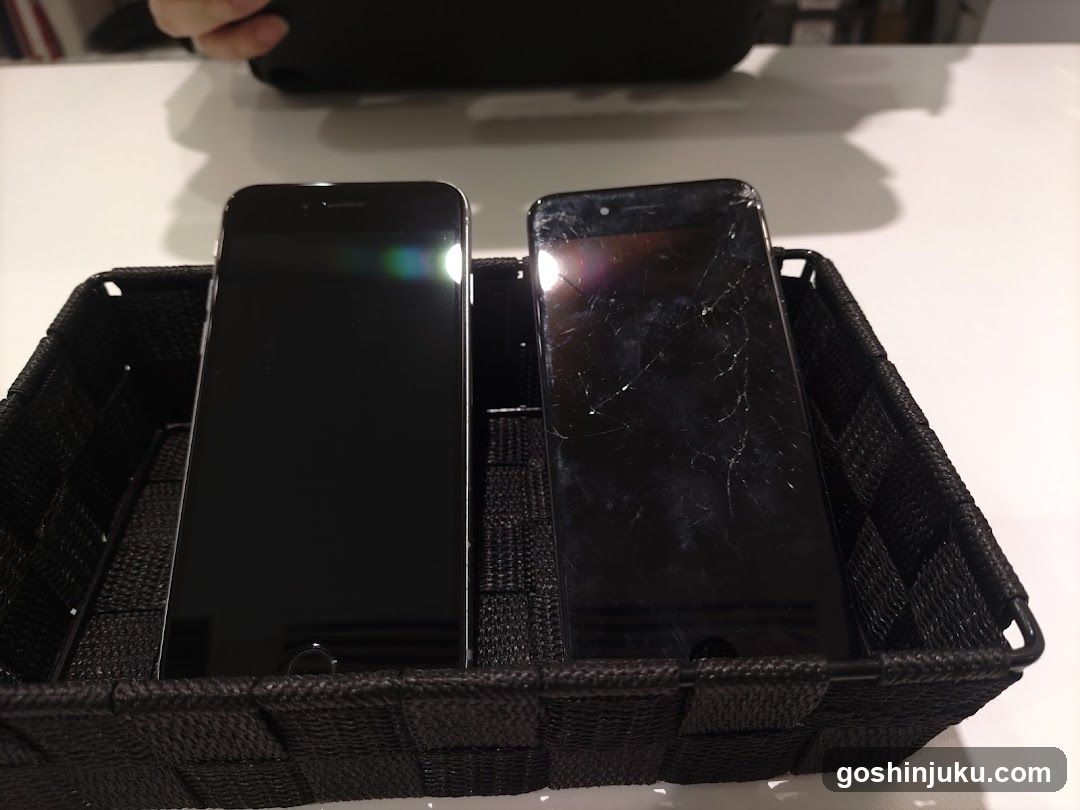 Two smartphones in a basket