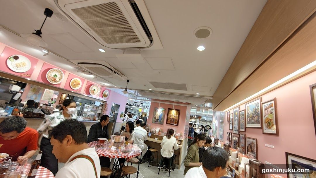 Restaurant Interior with Pink Walls and Patrons