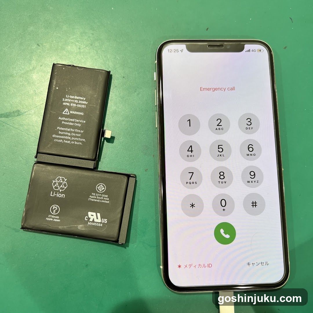 iPhone with Emergency Call Screen and Batteries