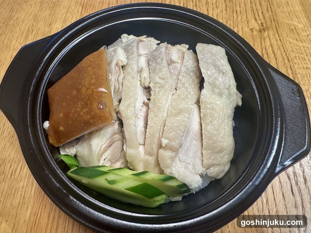 Sliced Chicken with Sauce and Cucumber in Clay Pot