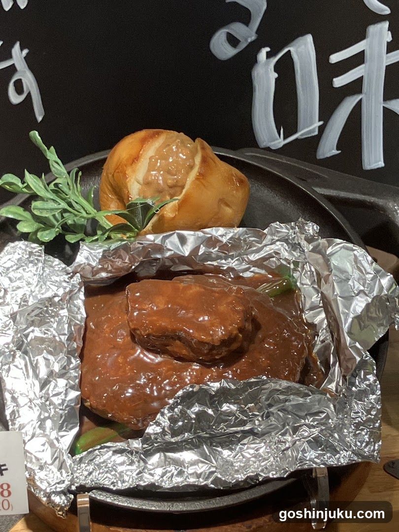 Steak with Sauce and Bread Roll