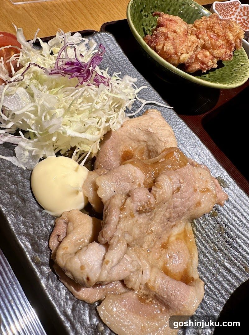 Japanese-style meal with pork and fried items