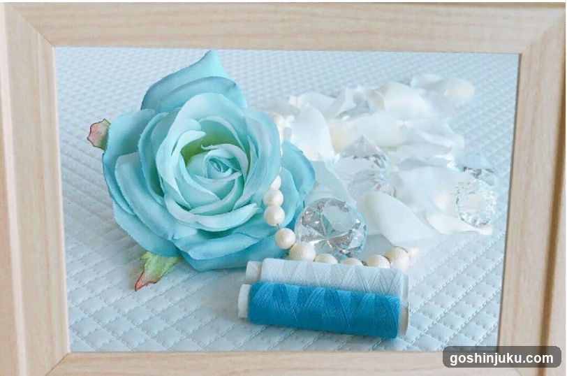 Blue Rose and Thread Arrangement