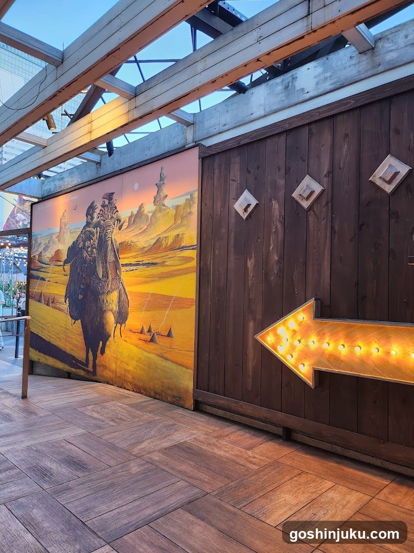 Desert Scene Mural with Arrow Signage