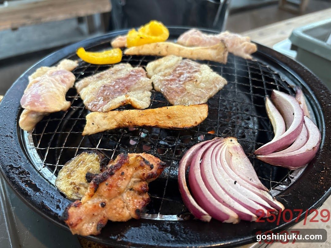 Grilled Meat and Vegetables on a Round Grill