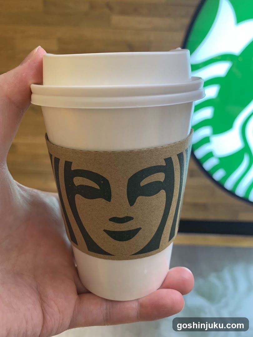 Starbucks Cup with Face Sleeve