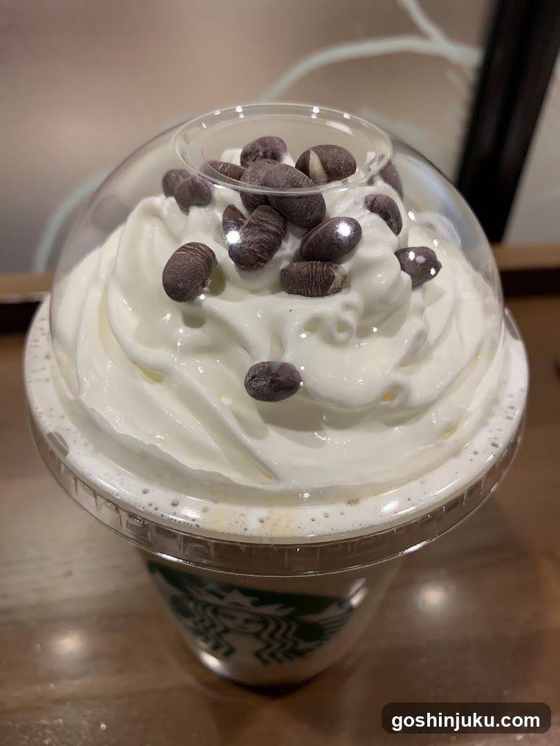 Starbucks Drink with Whipped Cream and Chocolate Beans