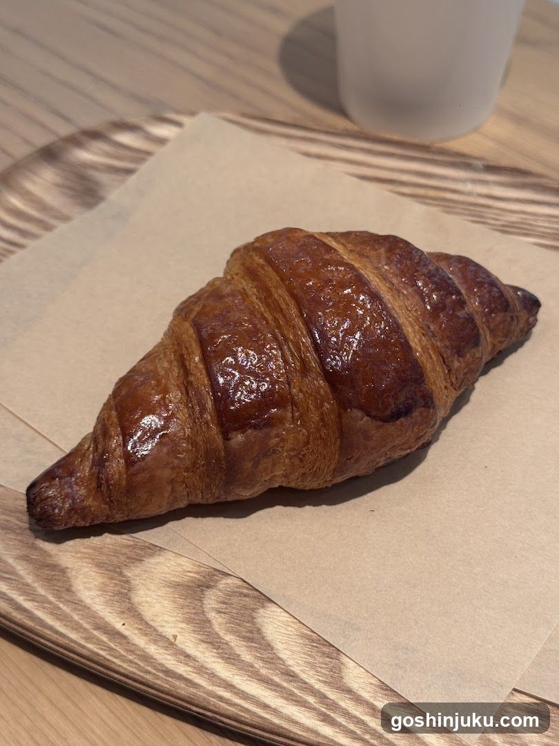 Croissant on wooden table