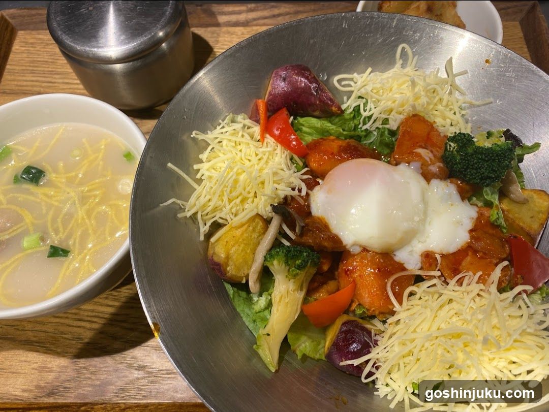 Bowl of Korean-style stir-fry with egg and soup