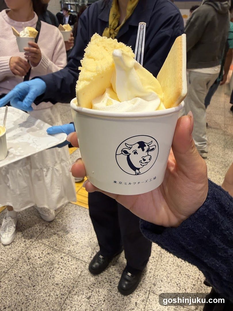 Ice cream cup with cake and whipped cream