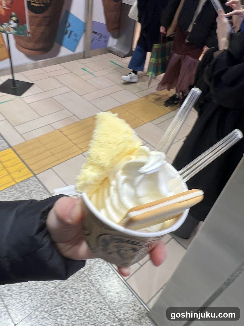 Ice cream cup with whipped cream and biscuit