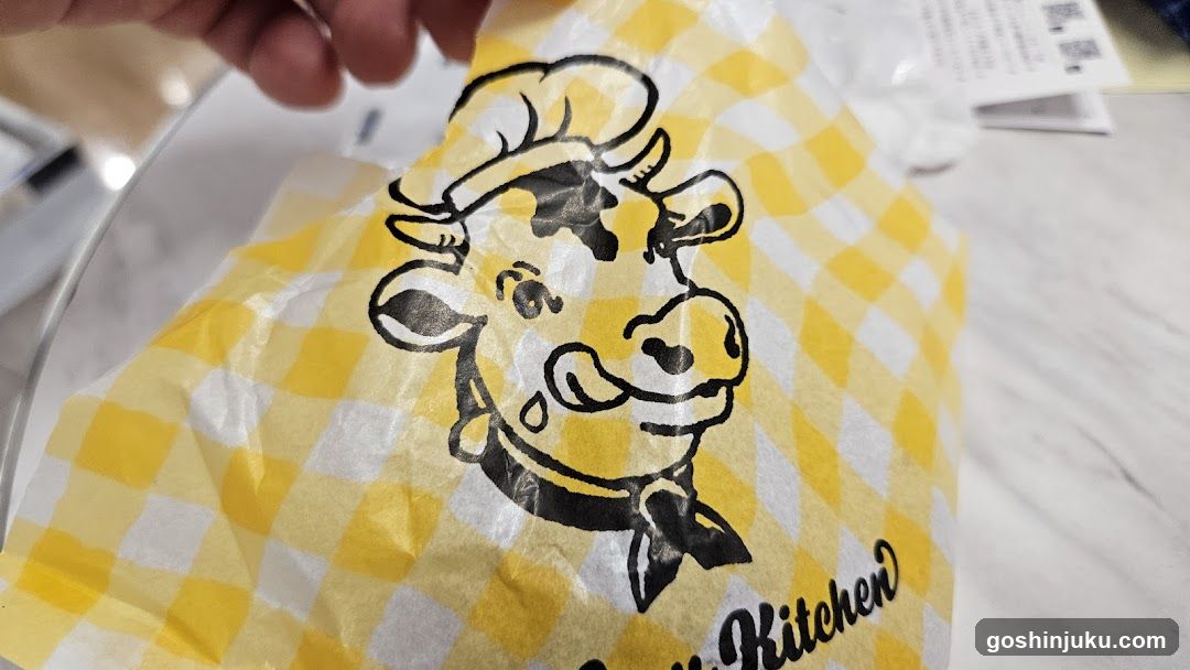 Yellow checkered paper with cow logo