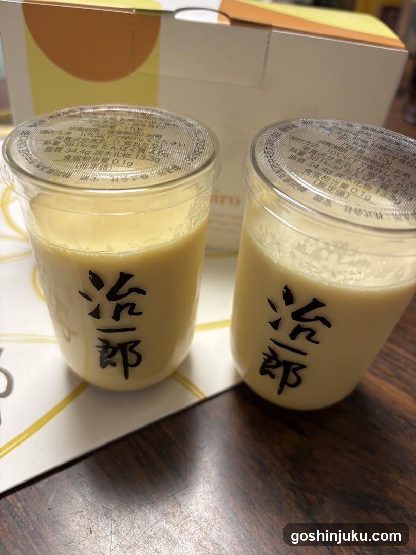 Two cups of creamy beverage with Japanese characters