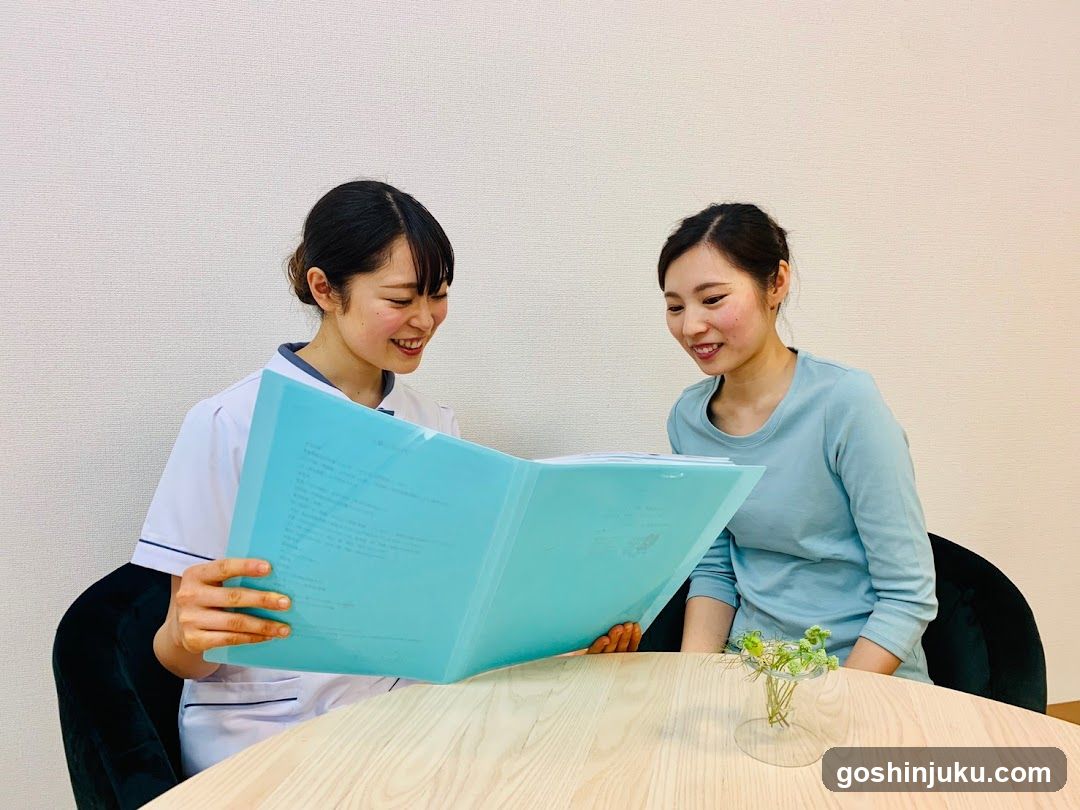 Two women reviewing documents at a table