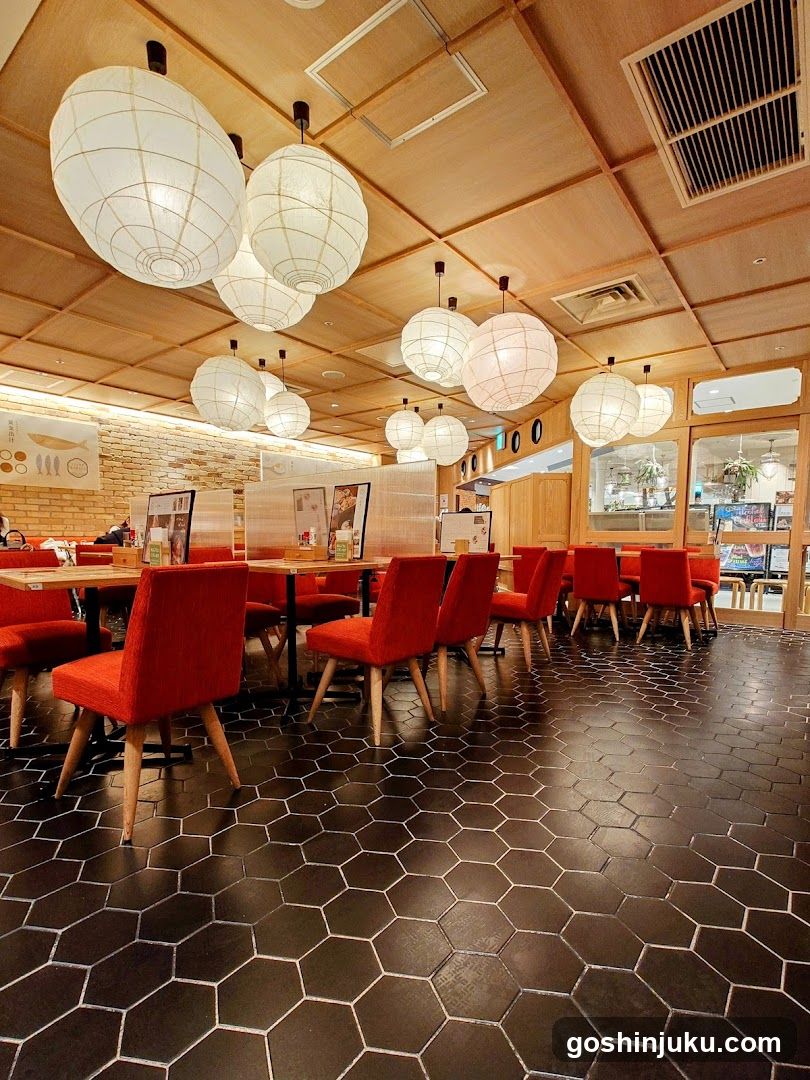 Restaurant Interior with Red Chairs and Paper Lanterns