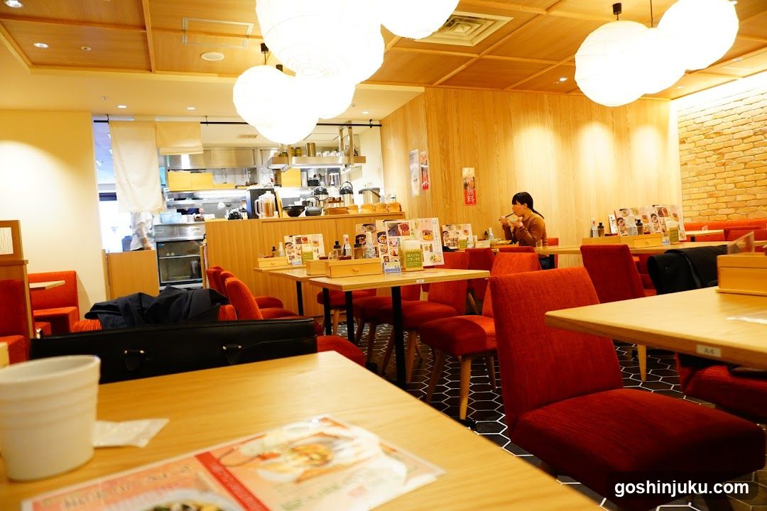 Restaurant Interior with Red Chairs and Wooden Tables