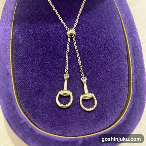 Gold Horsebit Pendant Necklace Display