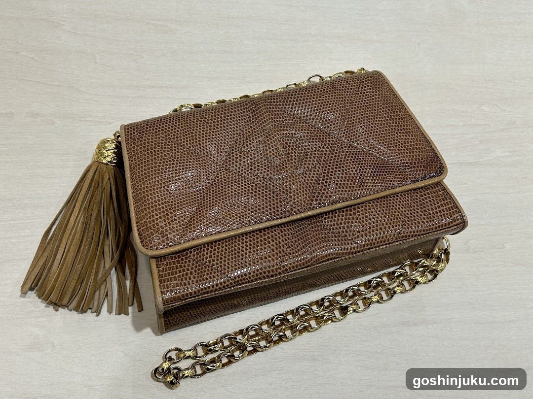 Brown Snake-Skin Patterned Handbag with Chain Strap and Tassel
