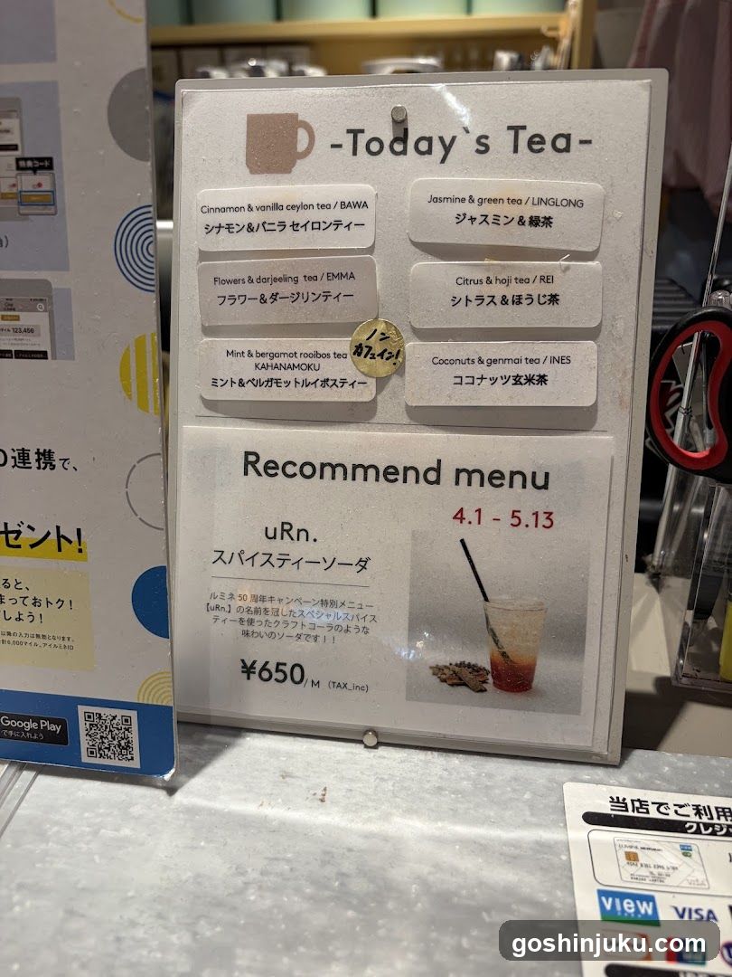 A display menu board featuring a selection of teas and a special offer.