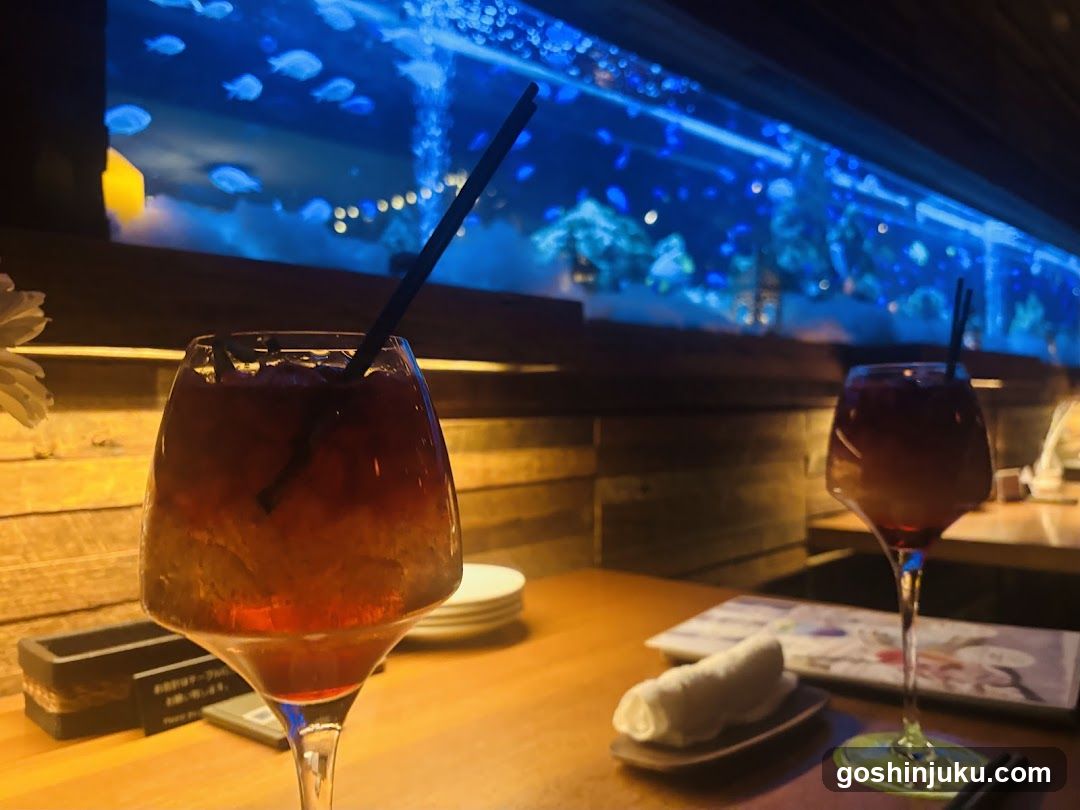 Drinks at a bar with aquarium view