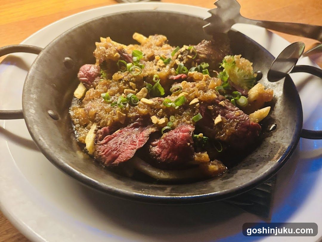 Sizzling Beef Dish in Metal Skillet