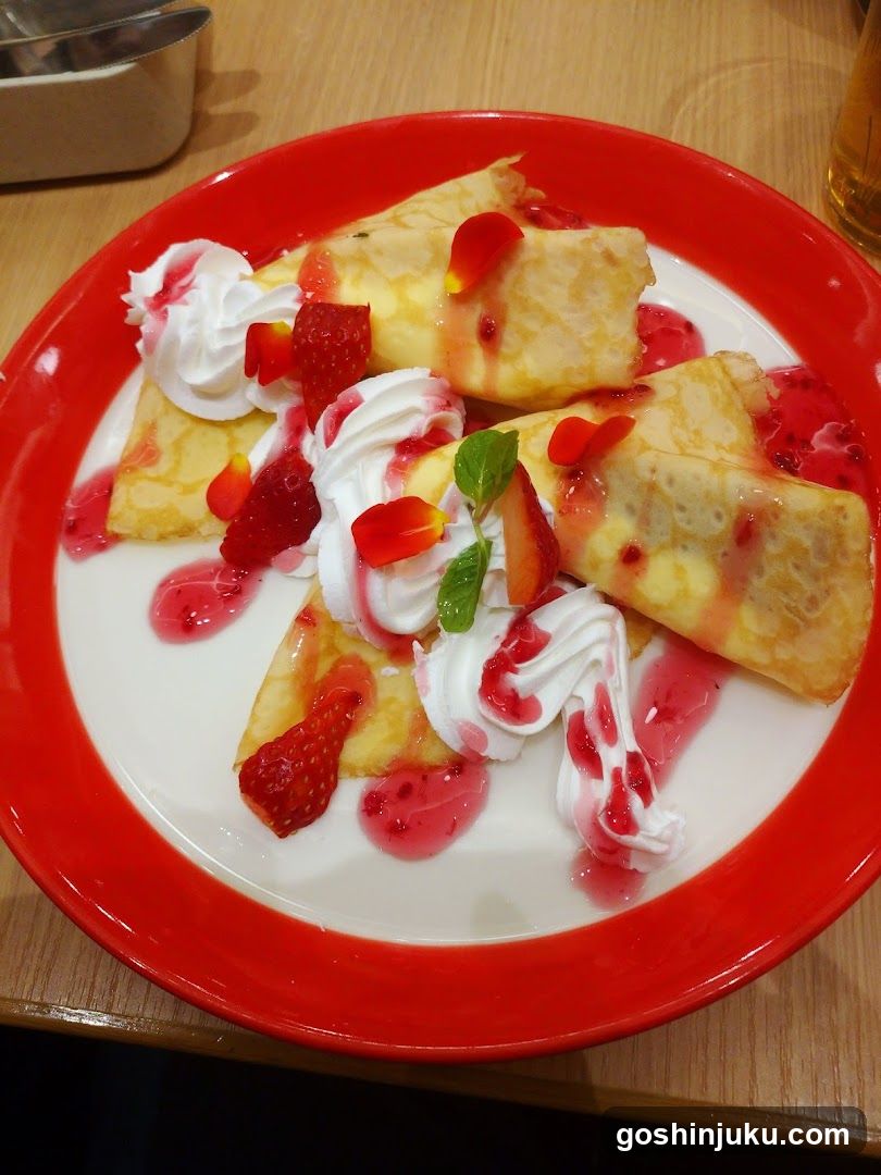 Strawberry Crepes with Whipped Cream and Sauce