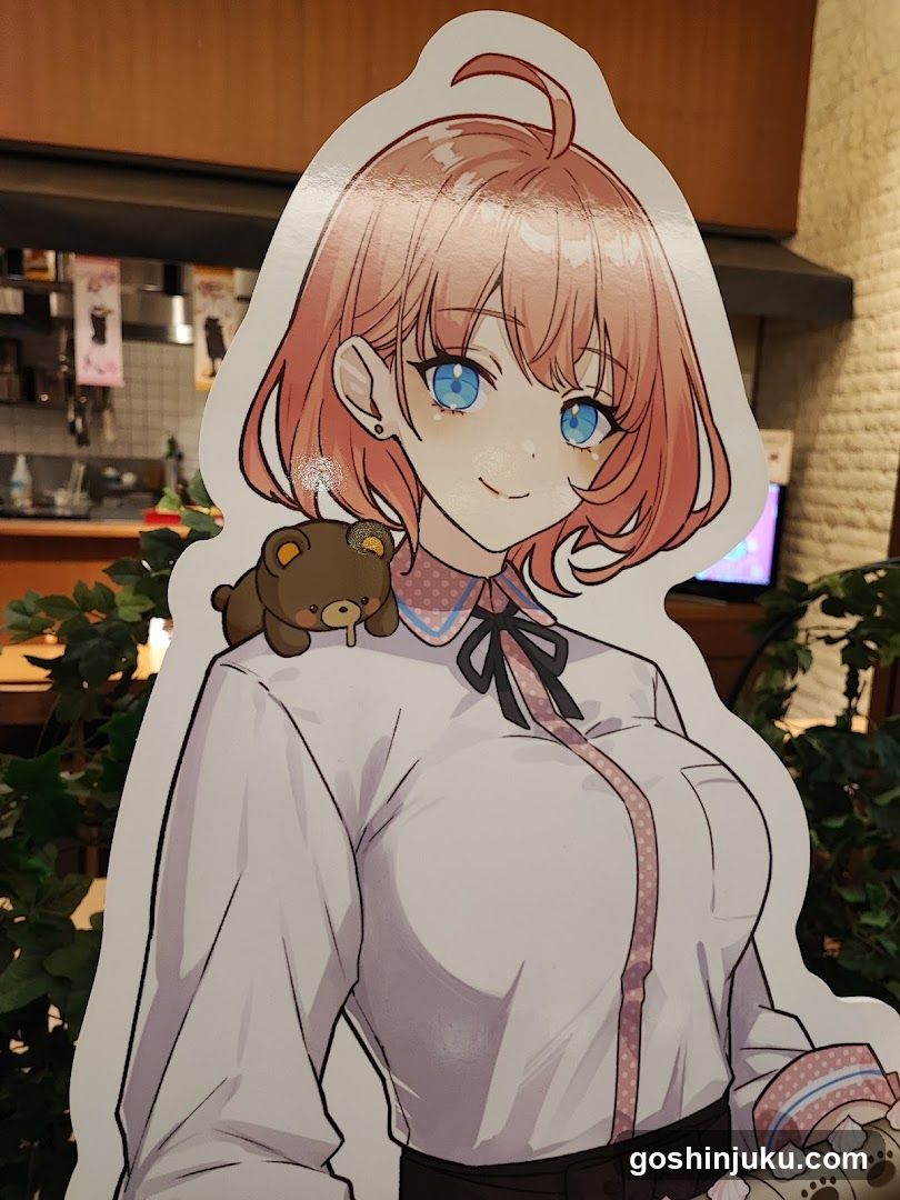Anime-style character cutout with teddy bear accessory
