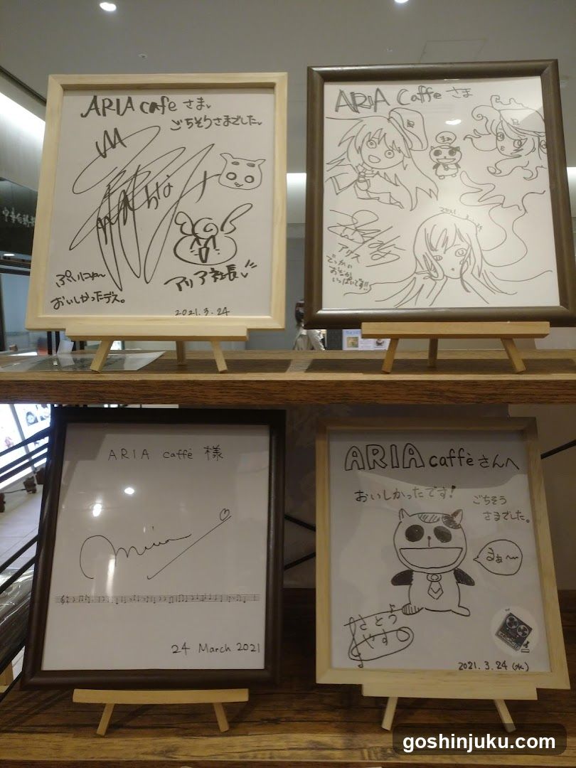 ARIA cafe signed art pieces display
