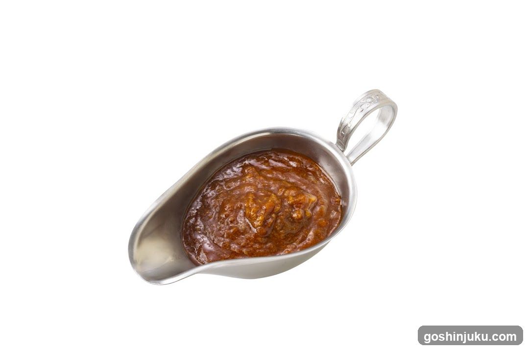 Sauce in a silver gravy boat