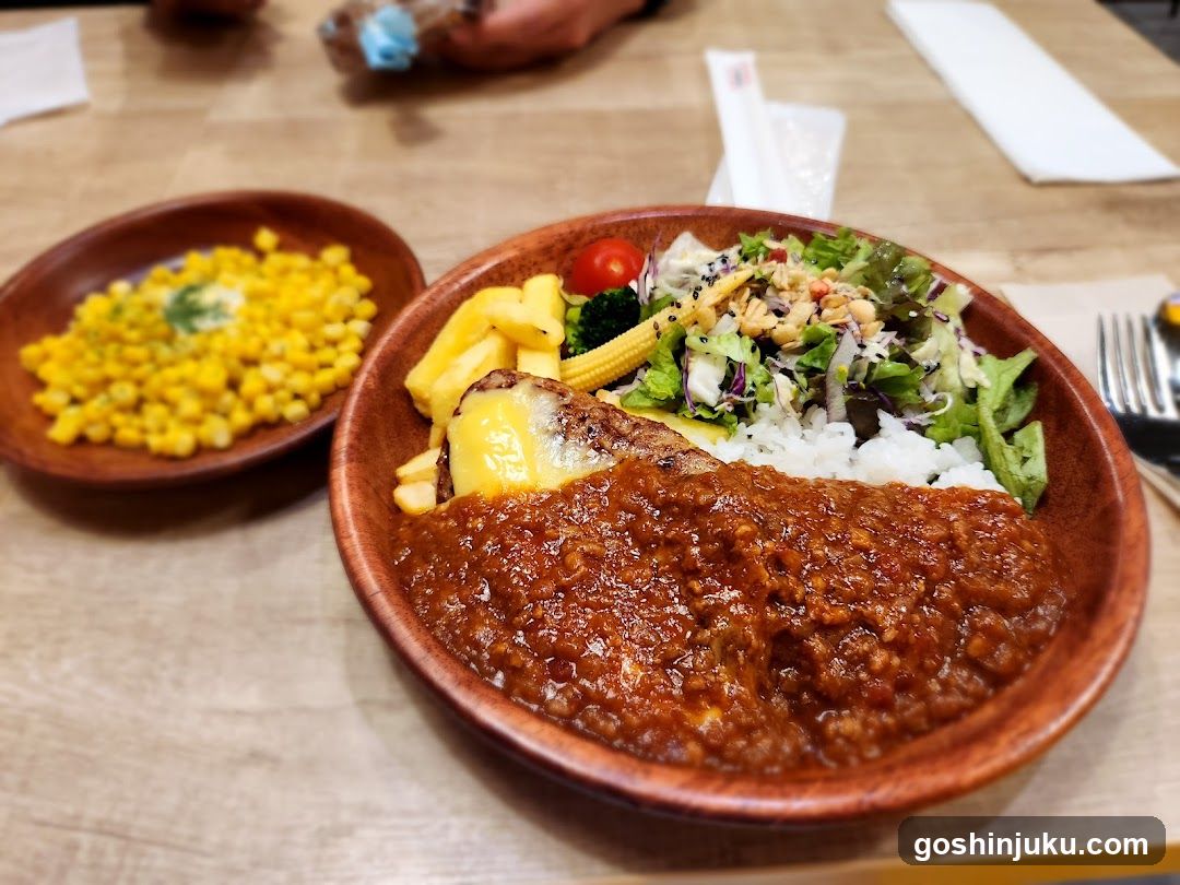Bowl of Curry Rice with Salad and Corn