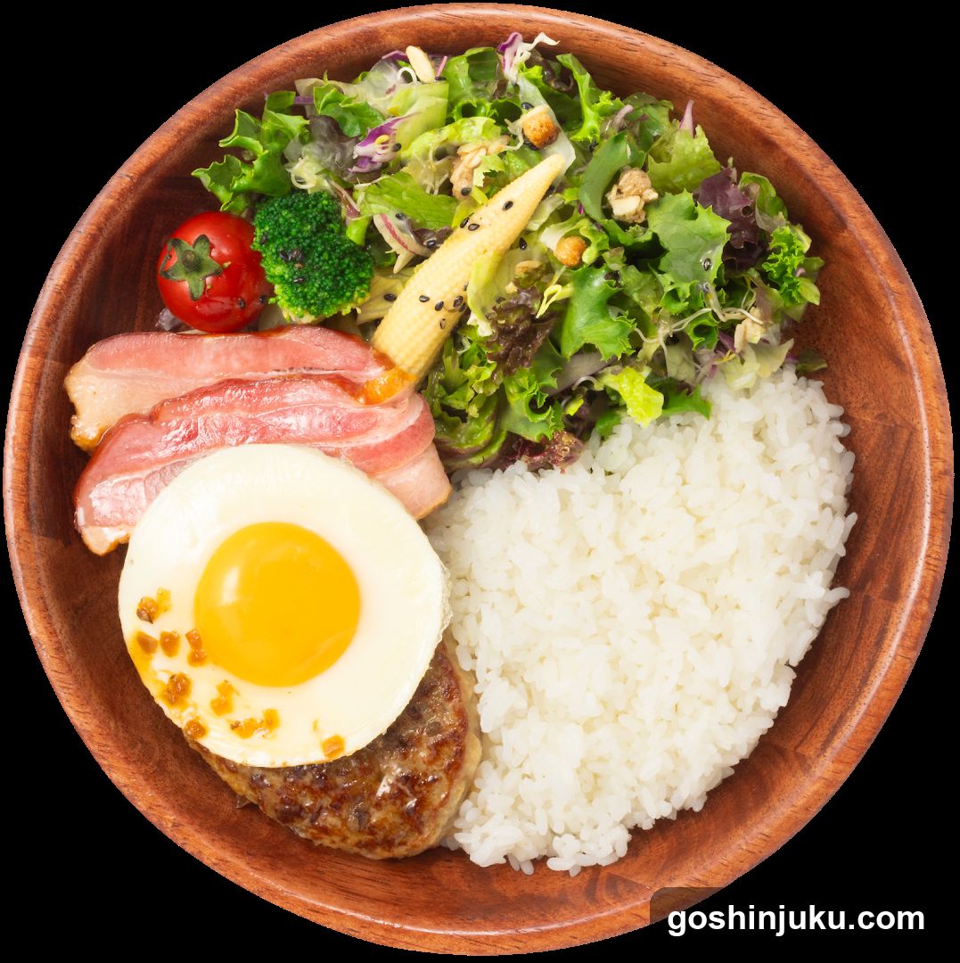 Bowl of food with rice, egg, bacon, and salad