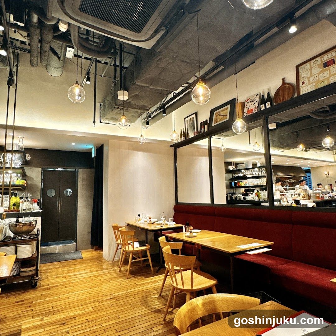 Restaurant Interior with Red Booth Seating and Exposed Ceiling