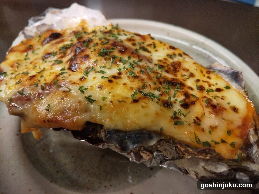 Grilled Oyster with Cheese and Herbs