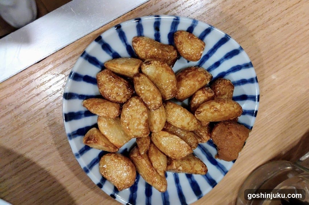 Fried Almonds on a Blue and White Plate
