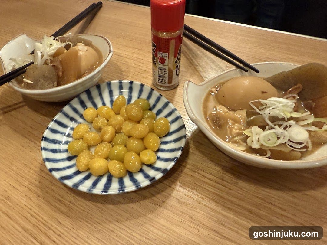 Ramen and Side Dishes on Wooden Table