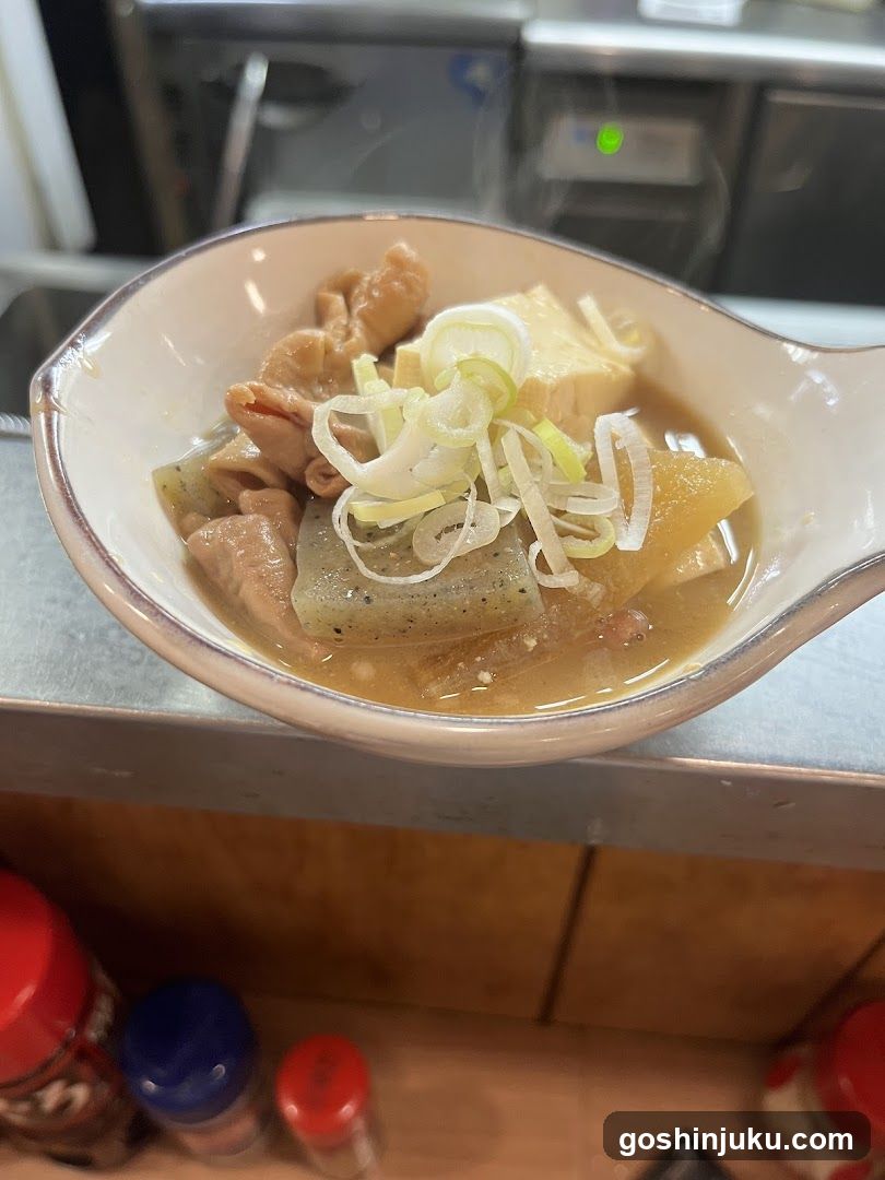 Bowl of Japanese-style soup with tofu and vegetables