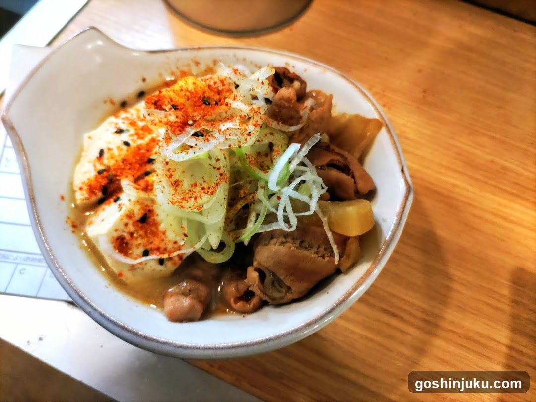 Bowl of Chicken Rice with Tofu and Seasoning