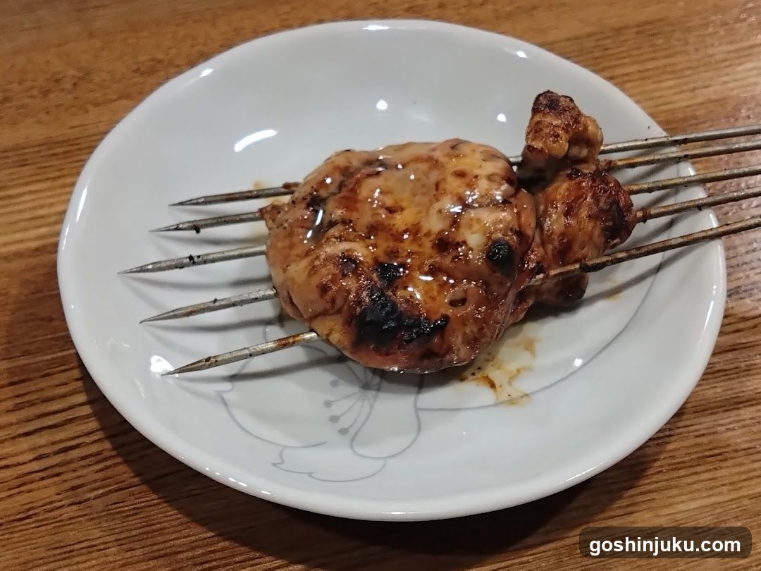Grilled Meat Skewers on a White Plate