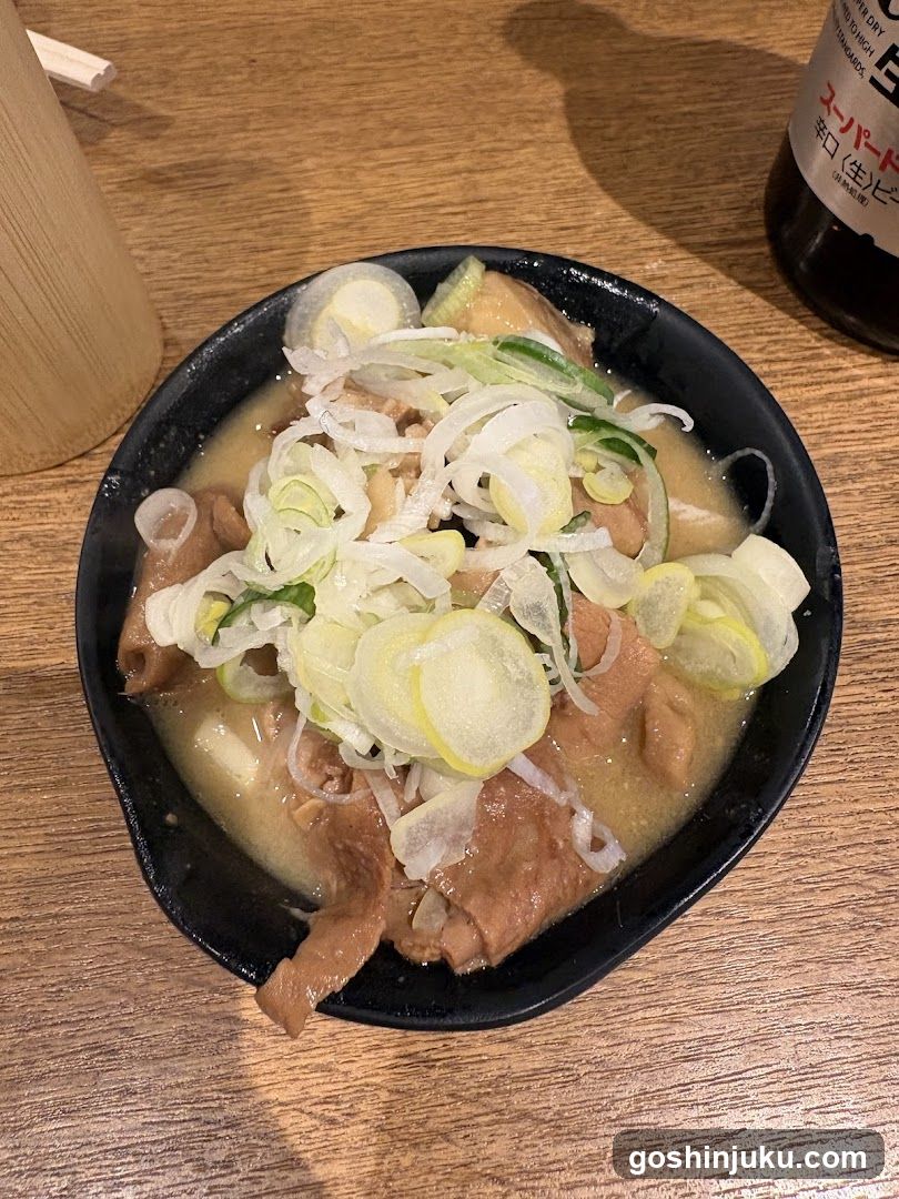 Bowl of Japanese-style soup with leeks and meat