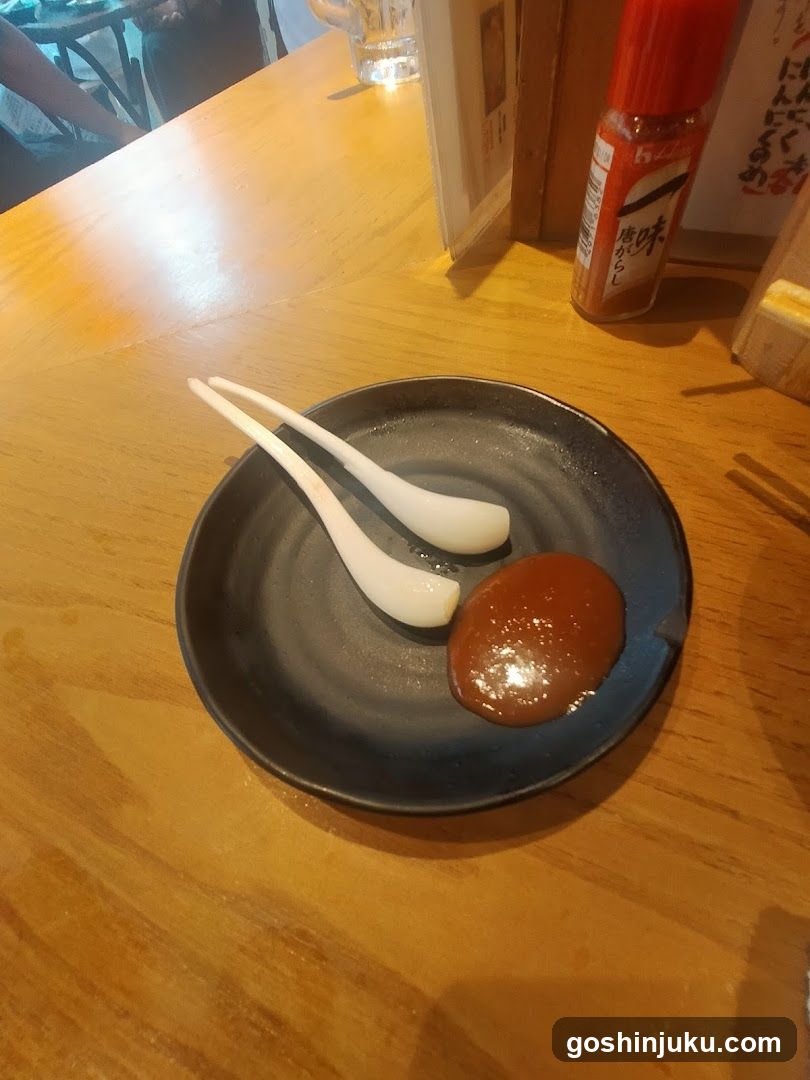 Dessert with sauce and spoons on a wooden table