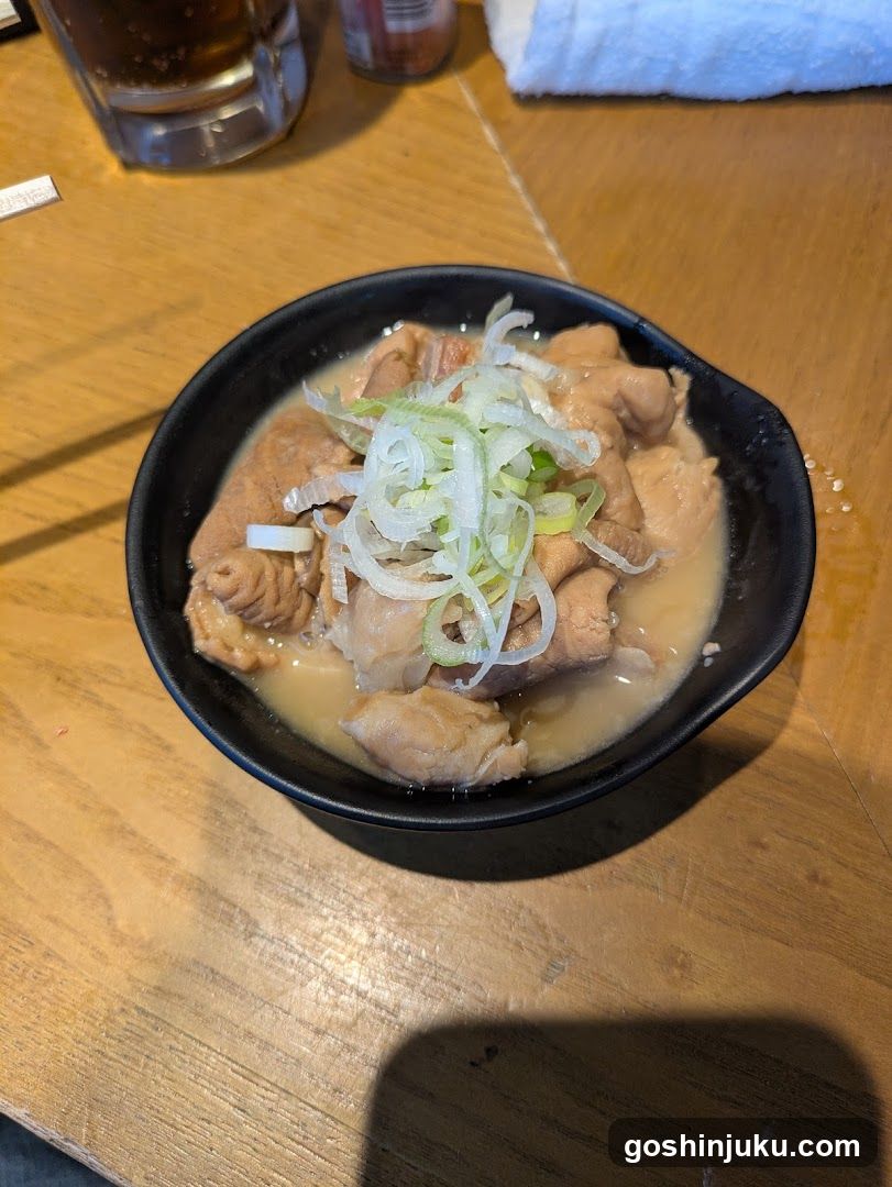 Bowl of Meat with Broth and Scallions