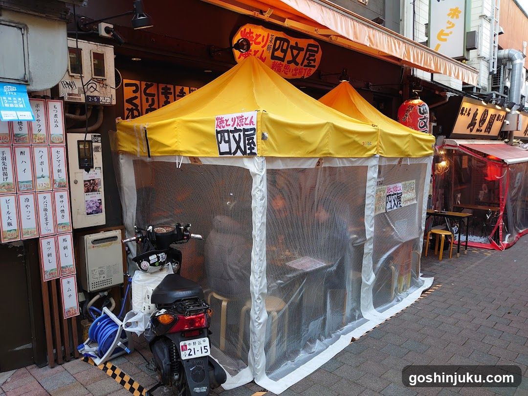 Outdoor Dining Setup with Yellow Tents