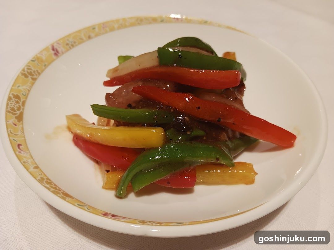 Stir-fried vegetables with meat on a decorative plate
