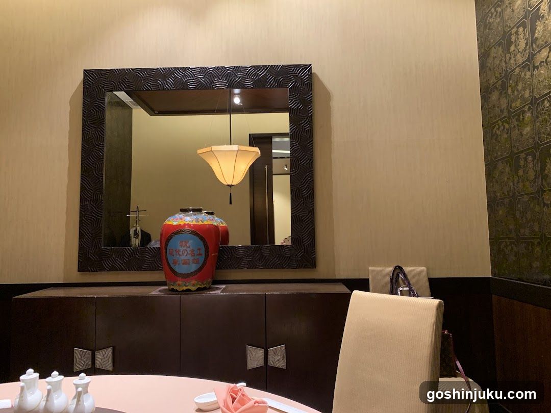 Dining Room Interior with Decorative Vase and Mirror