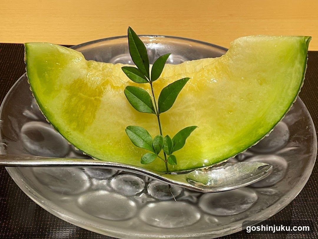 Sliced Melon with Green Leaf Garnish