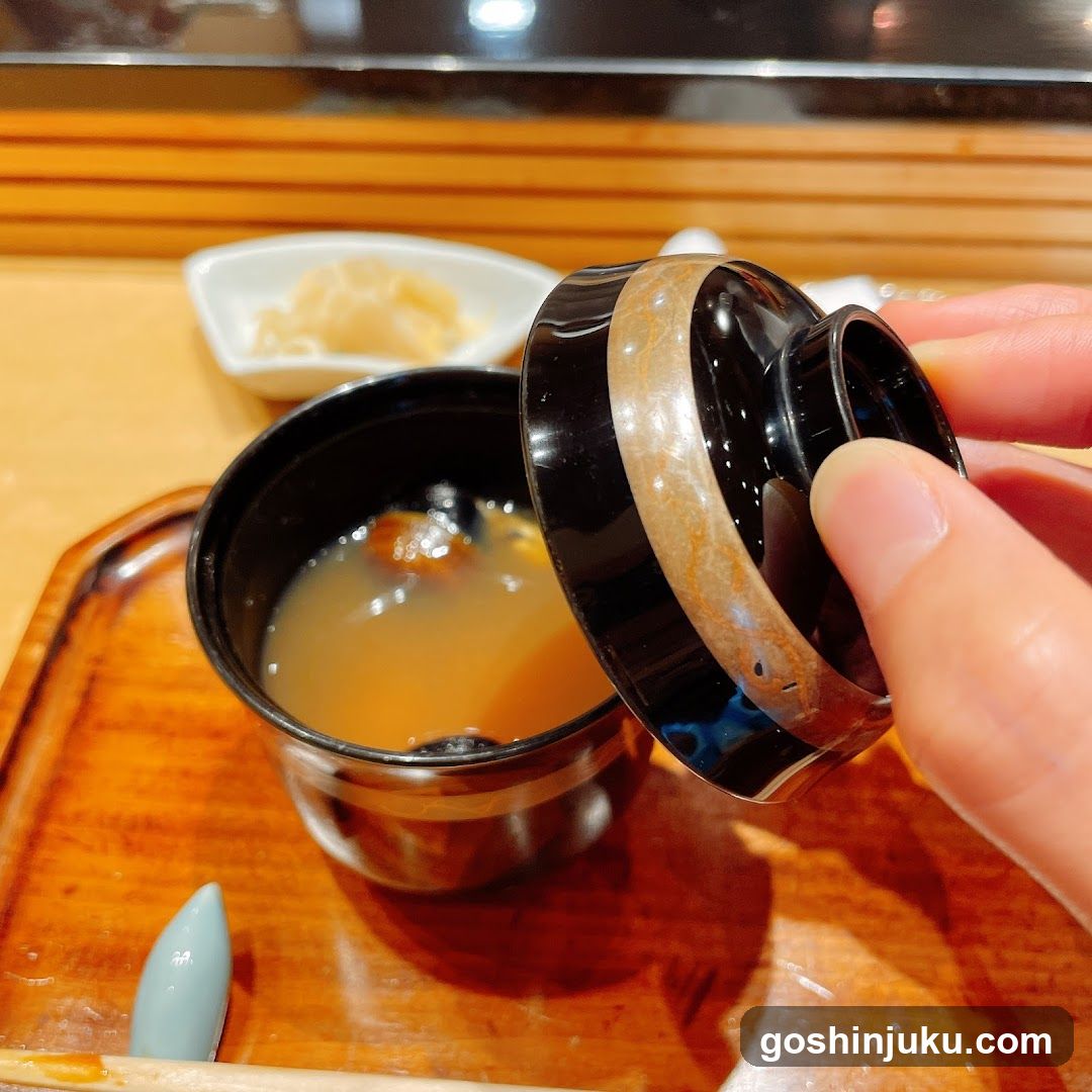 Dish Soup with Lid Being Removed