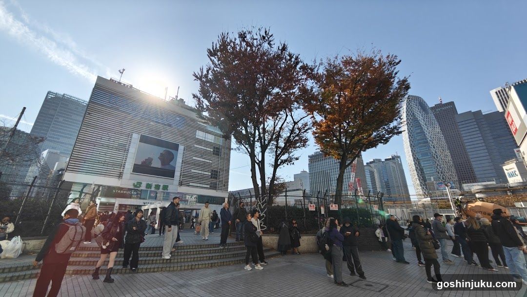 Urban plaza with autumn trees and modern buildings