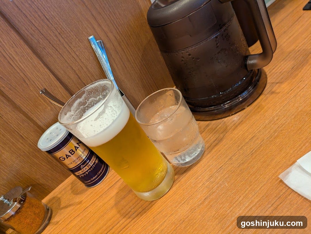 Beer and Water on Wooden Table